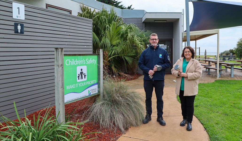 Bellarine Bayside CEO Brice Elliot and Barwon Water Sustainable Water Use Team Leader Jacinta Burke pictured in front of a recently upgraded bathroom facility featuring 5-star WELS rated showerheads to help reduce water use.